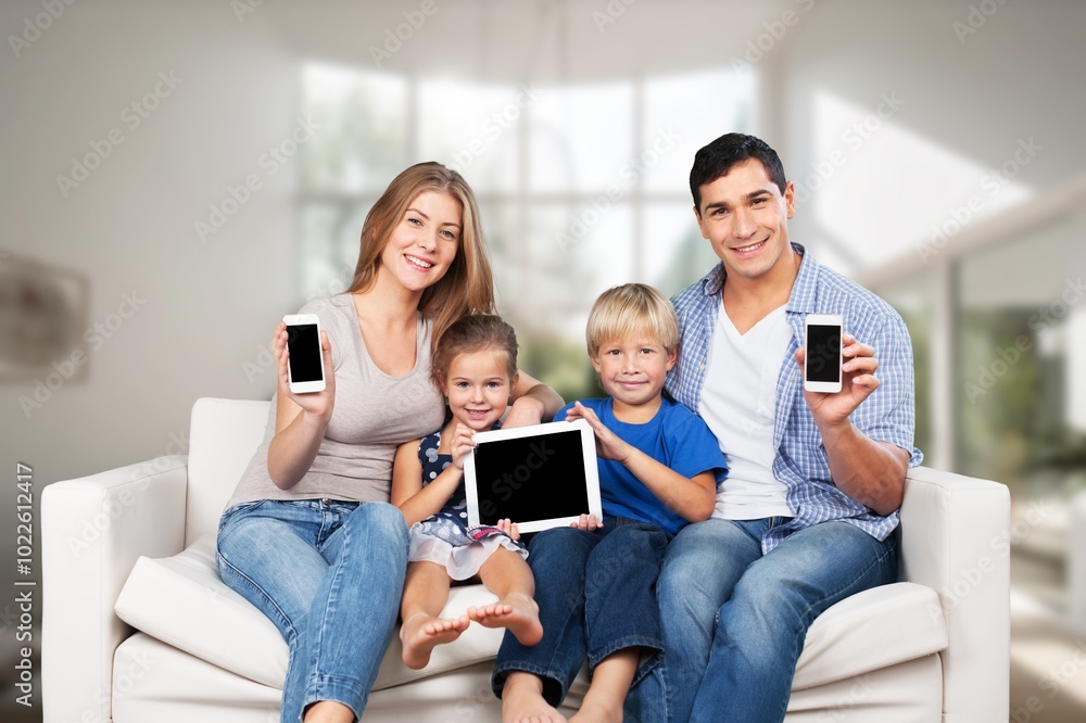 Portrait of happy young family with children using gadgets Portrait of happy young family with children using gadgets