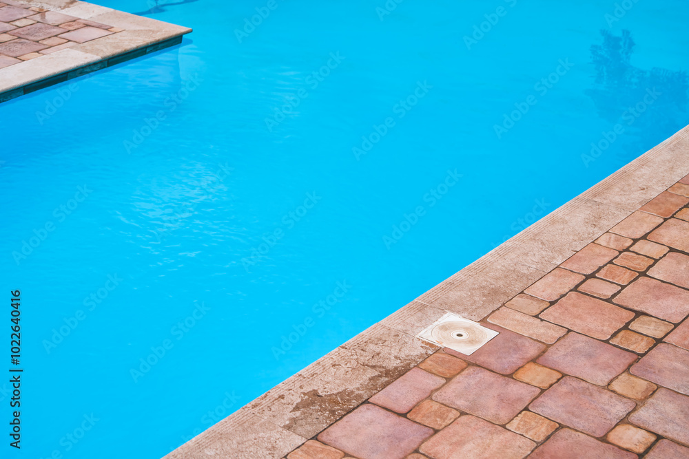 Fototapeta premium Poolside with metal railings and calm water