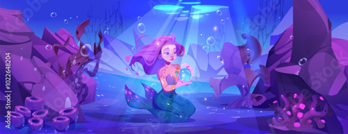 Mermaid sitting on sea bottom. Vector cartoon illustration of underwater world, beautiful female creature with fish tail and pink hair holding bubble in hand, sunlight, stones and seaweeds under water