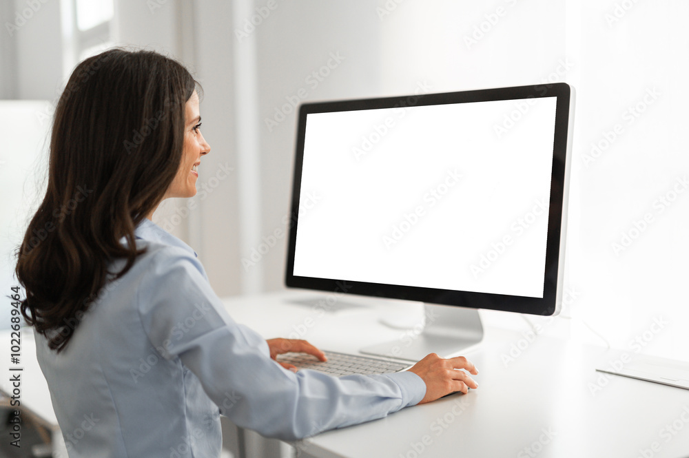 Young woman working on her computer with mockup screen Young woman working on her computer with mockup screen