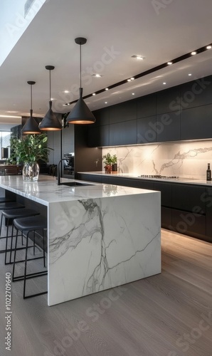 Modern kitchen with marble island and stools. photo