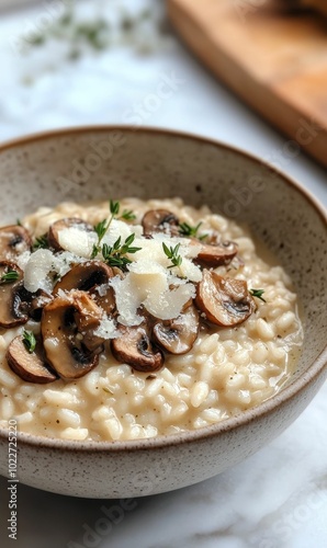 Mushroom risotto with parmesan cheese and thyme.