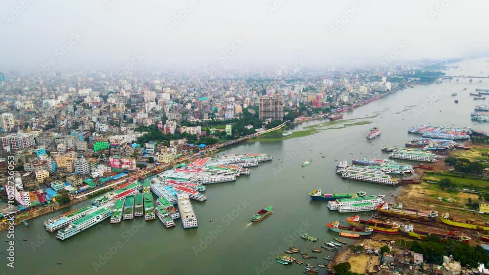 Aerial View OF Dhaka city skyline with boats waiting for repair in the buriganga river, bangladesh Aerial View OF Dhaka city skyline with boats waiting for repair in the buriganga river, bangladesh