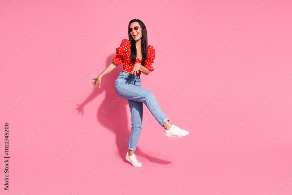 Full size photo of pretty young woman dance empty space wear top isolated on pink color background