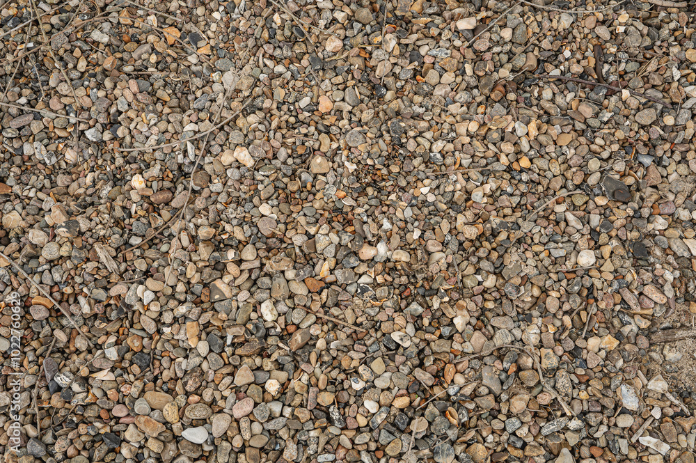 a pattern of small stones lying on a beach to use as a background