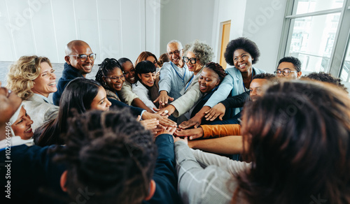 Fotografie Diverse team of smiling people united in a group huddle showcasing unity and tea