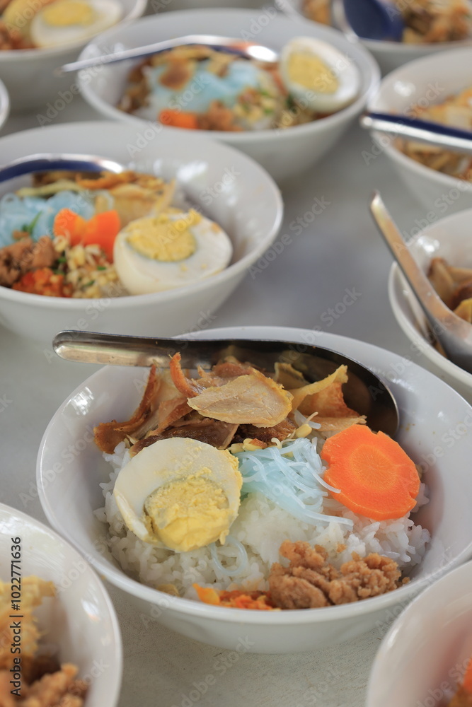 Soto ayam is a typical Indonesian food in the form of a kind of chicken soup with a yellowish gravy Soto ayam is a typical Indonesian food in the form of a kind of chicken soup with a yellowish gravy