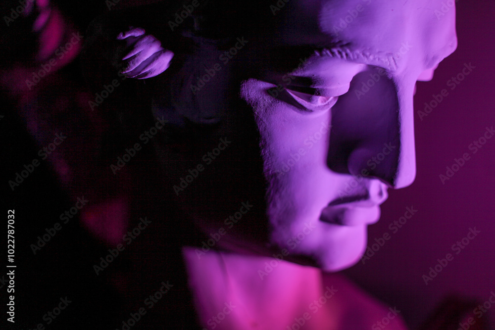 A statue with purple light A statue with purple light