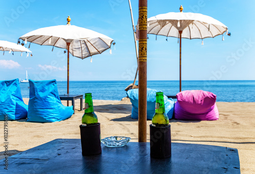 Table with two bottles of beer, Bali, Indonesia, Southeast Asia. photo