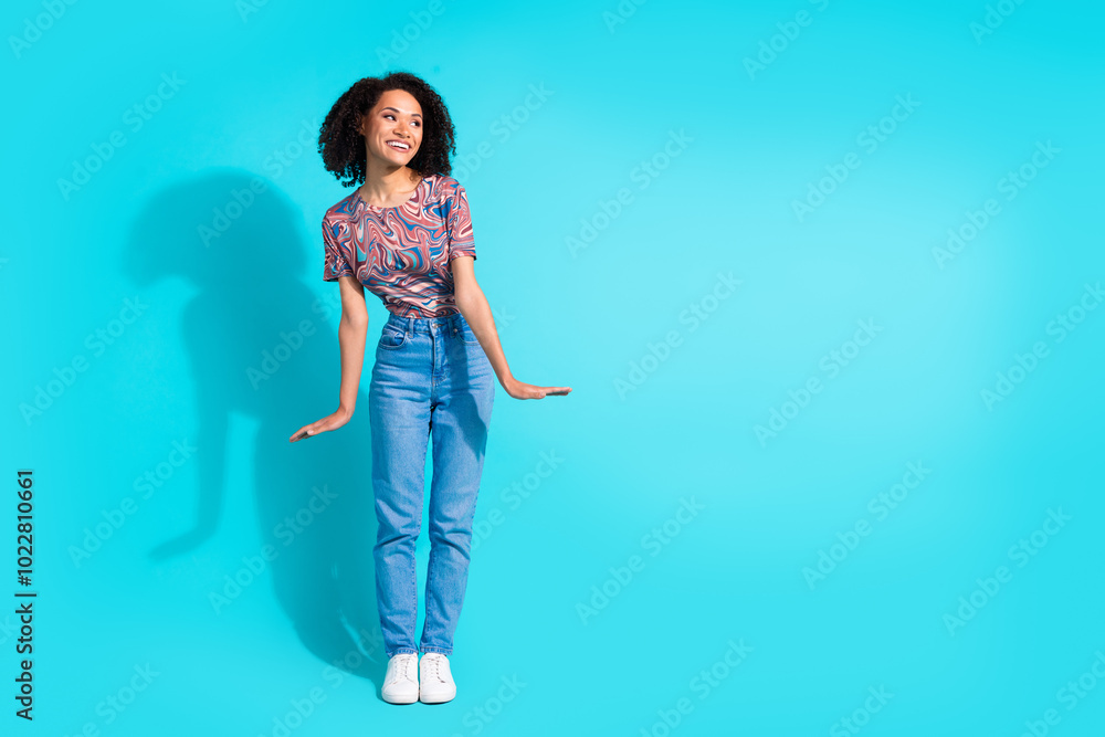 Full body photo of pretty young girl cute model look empty space wear trendy colorful clothes isolated on aquamarine color background Full body photo of pretty young girl cute model look empty space wear trendy colorful clothes isolated on aquamarine color background