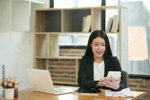 Asian business woman Working on paperwork at the office 