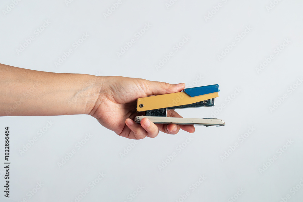 Stapler in hand isolated on white background Stapler in hand isolated on white background