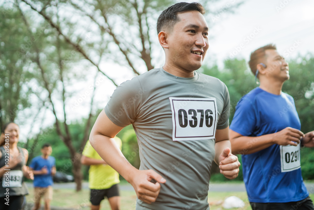 potrait of asian man happy for participating marathon event