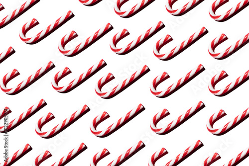 Obraz na płótnie Top view of assorted red and white candy canes on white background making a pattern w salonie