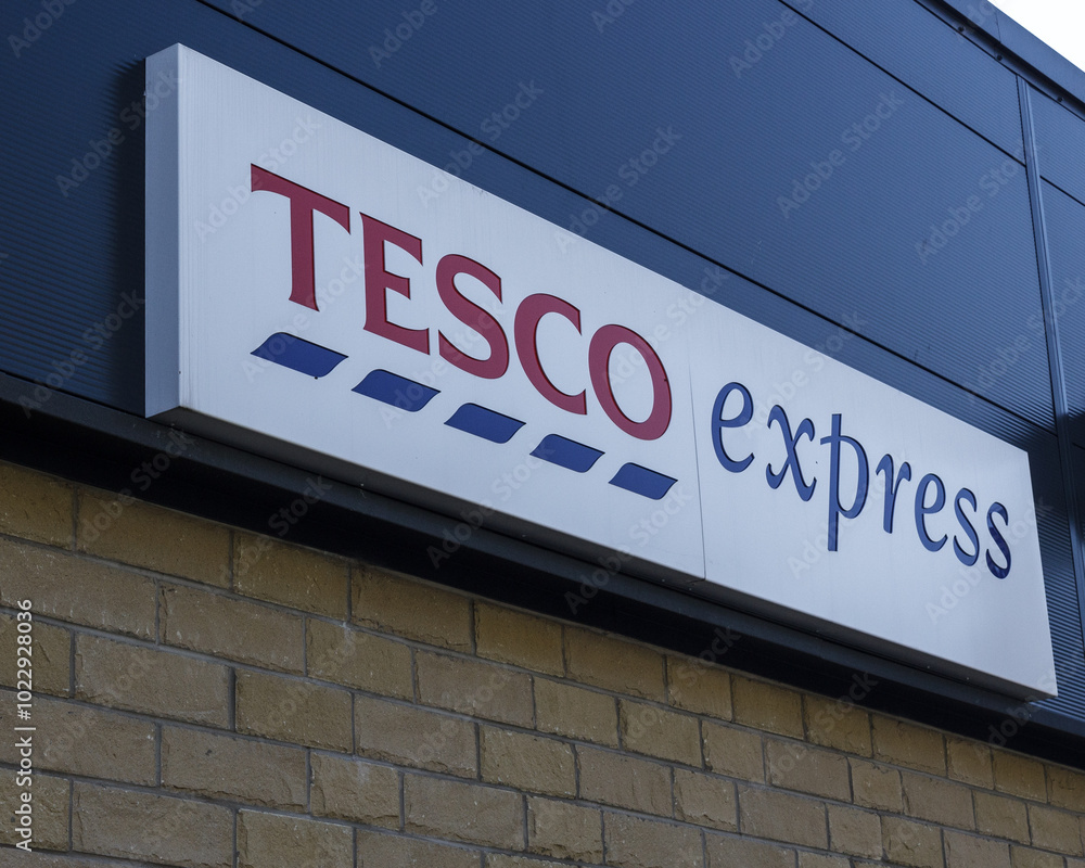 sign and logo of Tesco Express, the supermarket giant's chain of ...