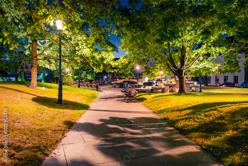 Illuminated night view of Karlskrona Square park. Splendid summer cityscape of Europe. Fantastic summer cityscape of Klaipeda port, Lithuania, Europe. Traveling concept background..