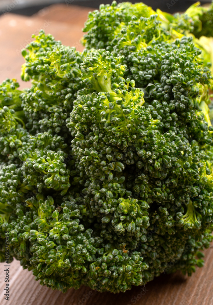 Raw fresh broccoli on old wooden table. Raw fresh broccoli on old wooden table.