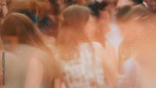 Close-up time-lapse unrecognizable blurry huge crowd of people crossing city street, busy crossroad fast motion, many pedestrians walking crosswalk. Rush hour crowded, people walk, blurred faces