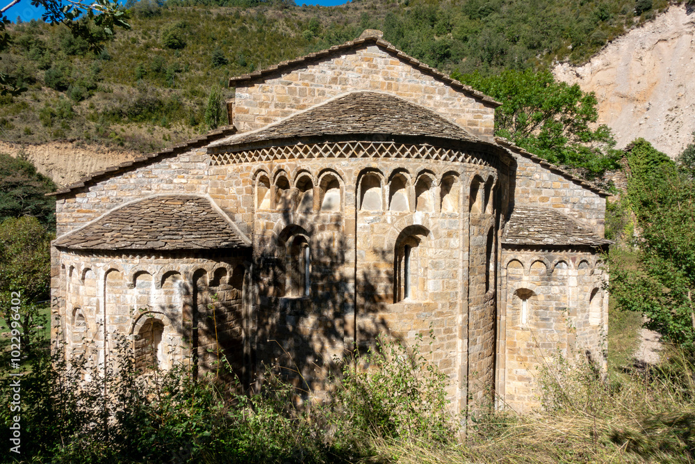 Lombard Romanesque apse of the church of the monastery of Santa María de Obarra from the 11th century. Huesca, Aragon, Spain. Lombard Romanesque apse of the church of the monastery of Santa María de Obarra from the 11th century. Huesca, Aragon, Spain.