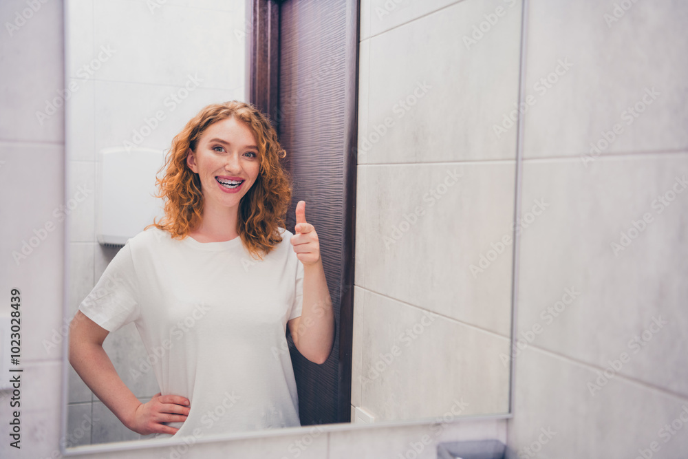 Photo of happy cute positive girl in bathroom enjoy morning routine procedure thumb up Photo of happy cute positive girl in bathroom enjoy morning routine procedure thumb up