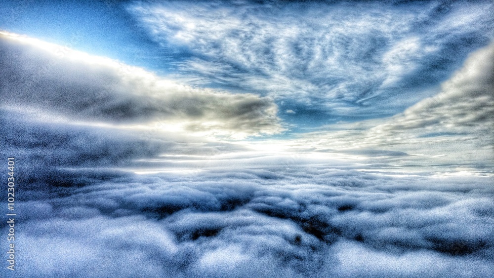 Fototapeta premium Abstract Blue and White Grainy Cloudscape Pattern Background Aerial View