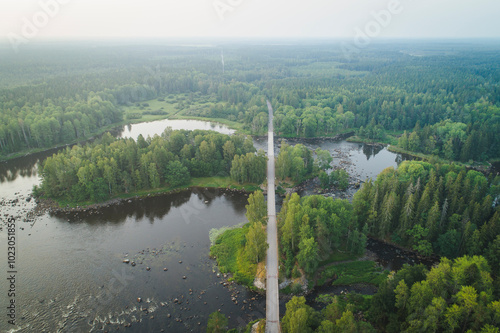 Aerial view of bridge over forest river in national park photo