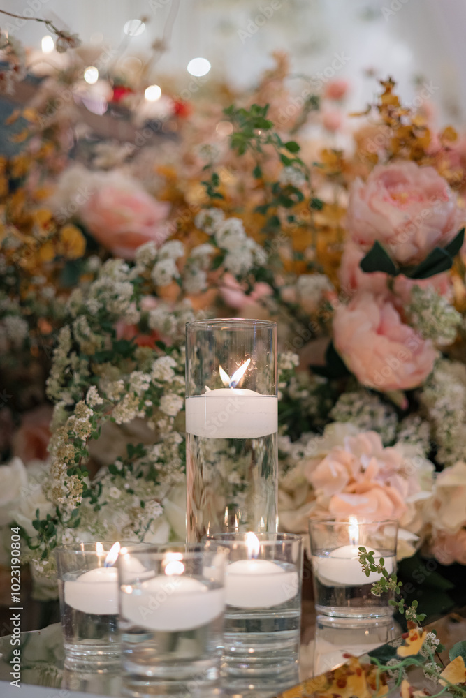 Elegant interior decor with white seating, golden candelabras, and floral arrangements Elegant interior decor with white seating, golden candelabras, and floral arrangements