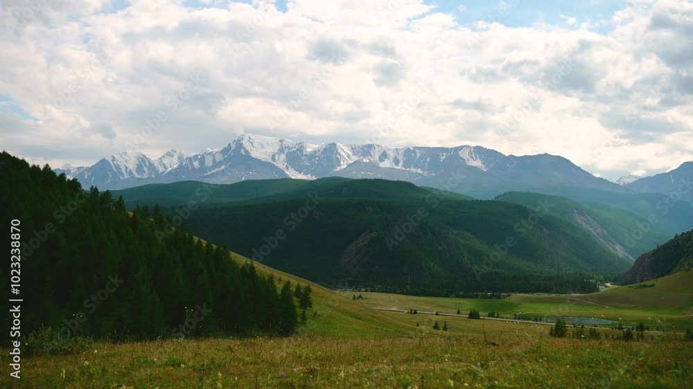 tamlaps, clouds are floating fast over a mountain lake and beautiful mountains in Altai tamlaps, clouds are floating fast over a mountain lake and beautiful mountains in Altai