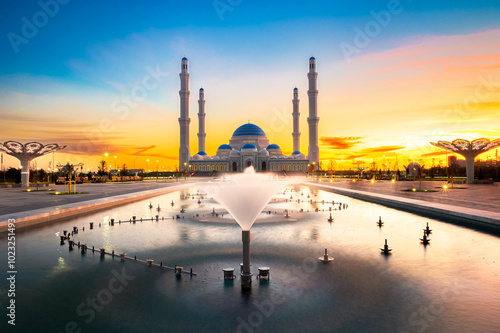 Fountains in front of the Central Mosque in Astana at sunset. Kazakhstan photo