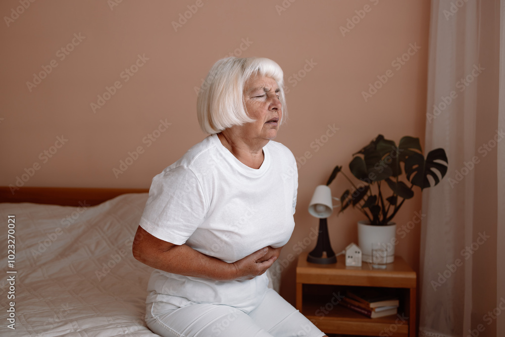 Abdominal pain in elder senior mature aging woman with stomachache illness from stomach cancer, irritable bowel syndrome, Indigestion, Diarrhea, gastroparesis or GERD Abdominal pain in elder senior mature aging woman with stomachache illness from stomach cancer, irritable bowel syndrome, Indigestion, Diarrhea, gastroparesis or GERD