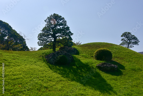 Suizenji Jojuen Garden is a tsukiyama Japanese garden located within Suizen-ji Park in the eastern part of the city of Kumamoto, Japan