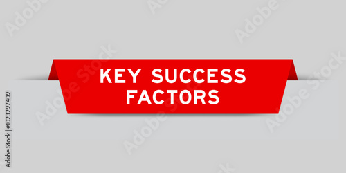 Red color inserted label with word key success factor on gray background