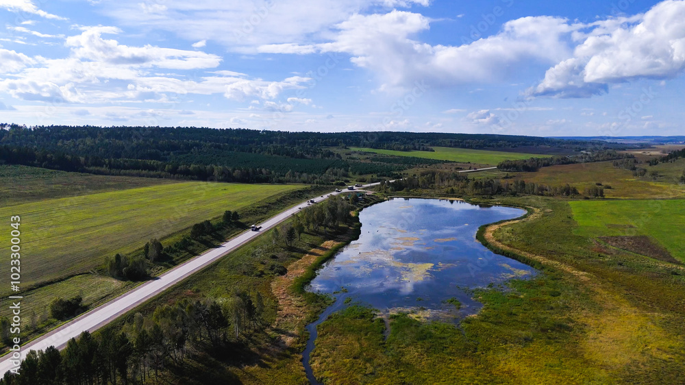 Obraz premium a truck is driving on the road view from a drone