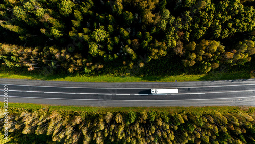 a truck is driving on the road view from a drone