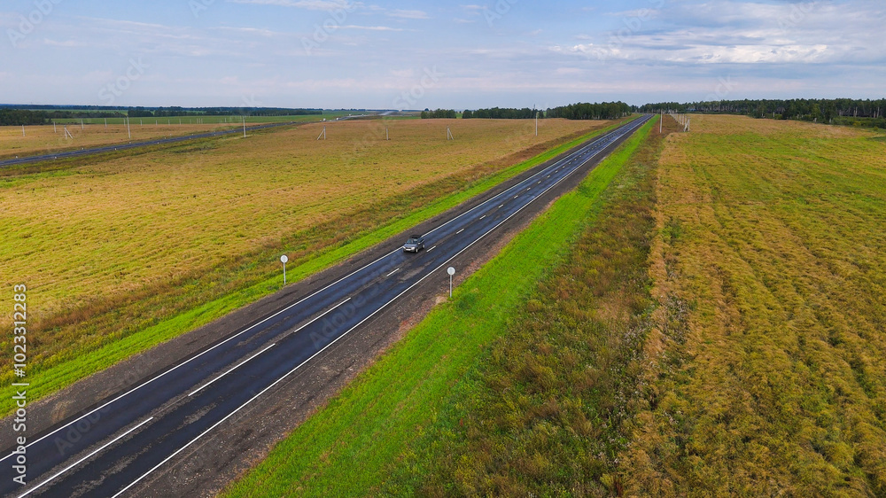 the car is driving along a beautiful road the car is driving along a beautiful road