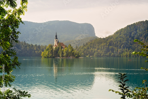 Bled, Slovenia - Aerial view of beautiful Lake Bled (Blejsko Jezero) with the Pilgrimage Church of the Assumption of Maria on a small island and Bled Castle and Julian Alps at backgroud at summer time photo