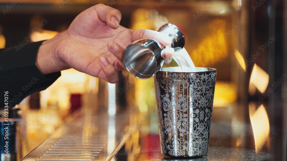 Closeup mixing hand bartender holding jigger to measure sugar salt all of ingredients into shaker preparation at bar. Special refresh drink showcasing nightlife mixology inviting warm light. Vinosity. Closeup mixing hand bartender holding jigger to measure sugar salt all of ingredients into shaker preparation at bar. Special refresh drink showcasing nightlife mixology inviting warm light. Vinosity.