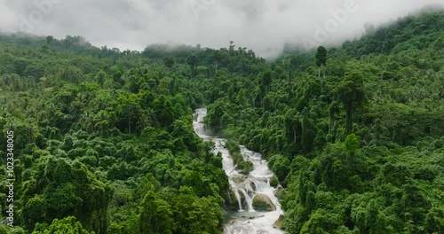 Drone view of beautiful multi-tiered waterfall. Aliwagwag Falls. Mindanao, Philippines. photo