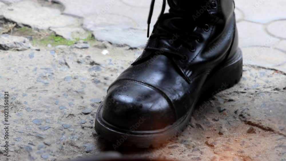Close-up of firefighter boots through flames, high lace-up boots in action Close-up of firefighter boots through flames, high lace-up boots in action