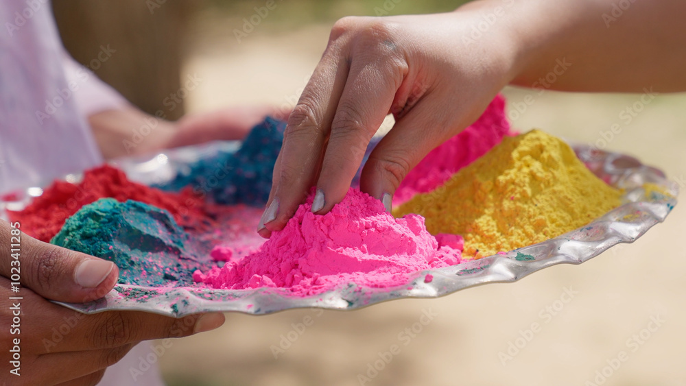 Closeup of Indian Woman Picking Holi Color From Thali Closeup of Indian Woman Picking Holi Color From Thali