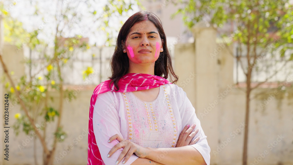 Confident Indian Woman with Holi Color on her Face Confident Indian Woman with Holi Color on her Face