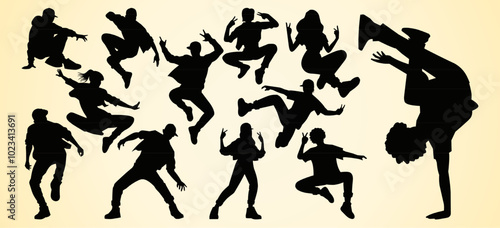 Silhouettes of dancers in dynamic poses, showcasing energetic movements and breakdancing, representing street dance and hip-hop culture.