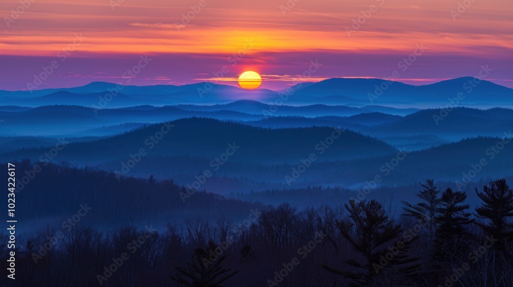 Fototapeta premium Serene Sunrise Over Misty Mountain Range