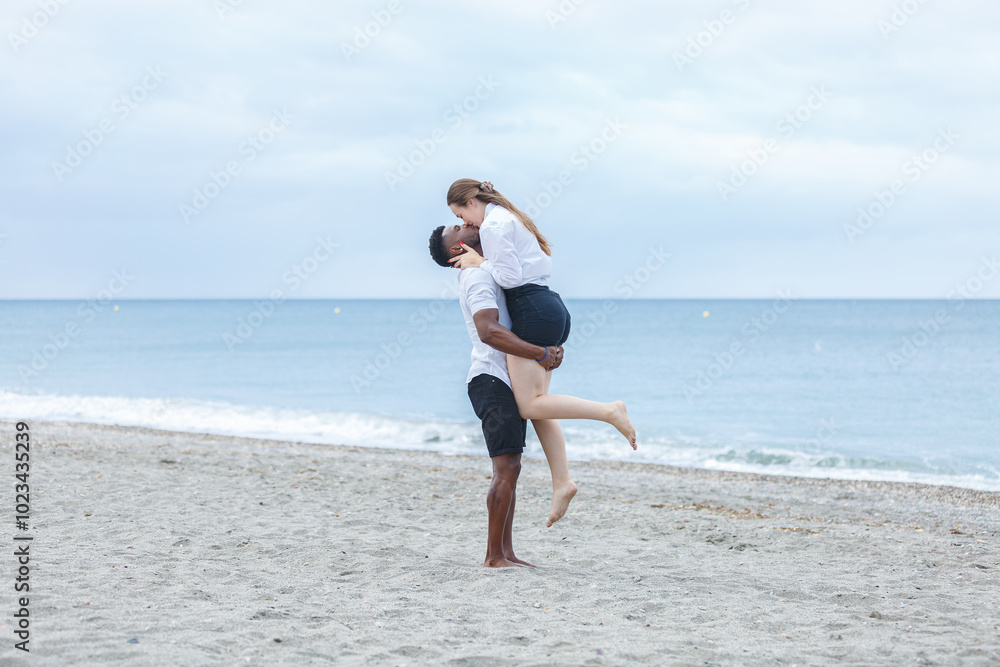A couple enjoying a romantic moment on Zapillo beach in Almeria, Spain, capturing the joy of love by the tranquil sea A couple enjoying a romantic moment on Zapillo beach in Almeria, Spain, capturing the joy of love by the tranquil sea
