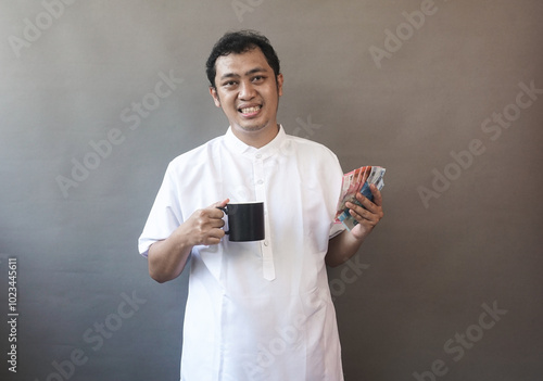 Asian Man moslem wearing white clothes it called baju koko show expression photo concept 