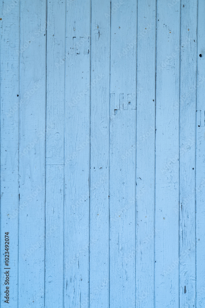 A light blue wooden wall displays a textured surface with natural imperfections, creating a rustic and inviting atmosphere indoors A light blue wooden wall displays a textured surface with natural imperfections, creating a rustic and inviting atmosphere indoors