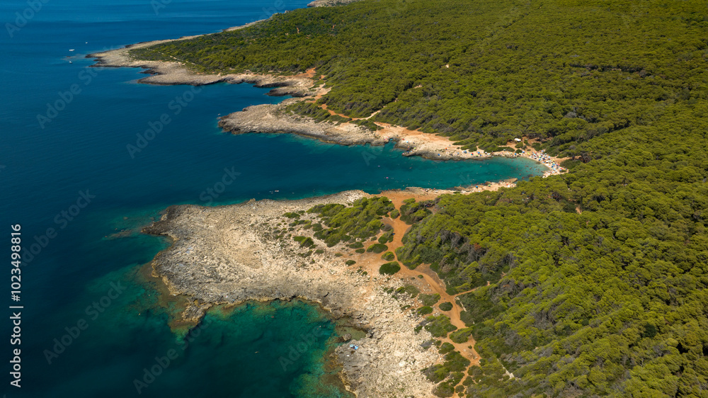 Aerial view of the beach in the Porto Selvaggio Regional Natural Park in Salento. It is a protected natural area of Puglia located in the province of Lecce, Italy. Aerial view of the beach in the Porto Selvaggio Regional Natural Park in Salento. It is a protected natural area of Puglia located in the province of Lecce, Italy.