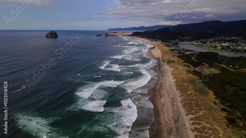 Wallpaper Mural Aerial drone footage over an ocean beach with crashing waves in oregon, USA Torontodigital.ca
