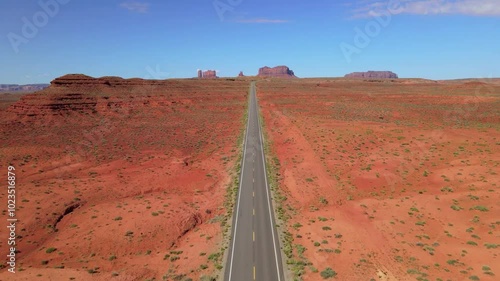 Wallpaper Mural Aerial drone footage of a long road in the red rock desert  on a clear day in Utah, USA Torontodigital.ca