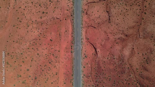 Wallpaper Mural Topdown Aerial drone footage over a red rock desert road in Utah, USA Torontodigital.ca